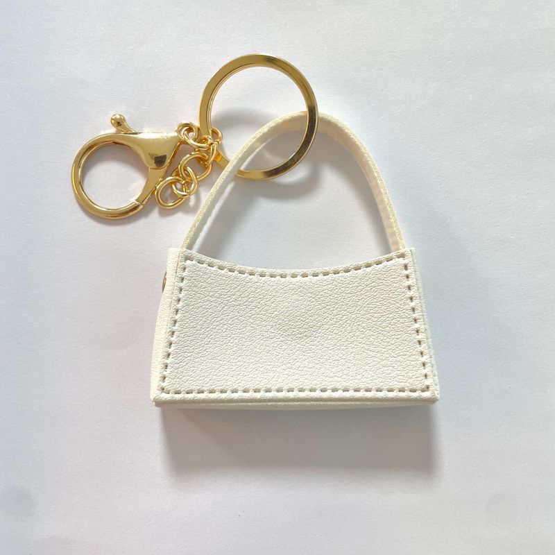 Porte-clés créatif en cuir avec pendentif rouge à lèvres, facile à transporter, avec fermeture à pression pour éviter les pertes._voghion.com
