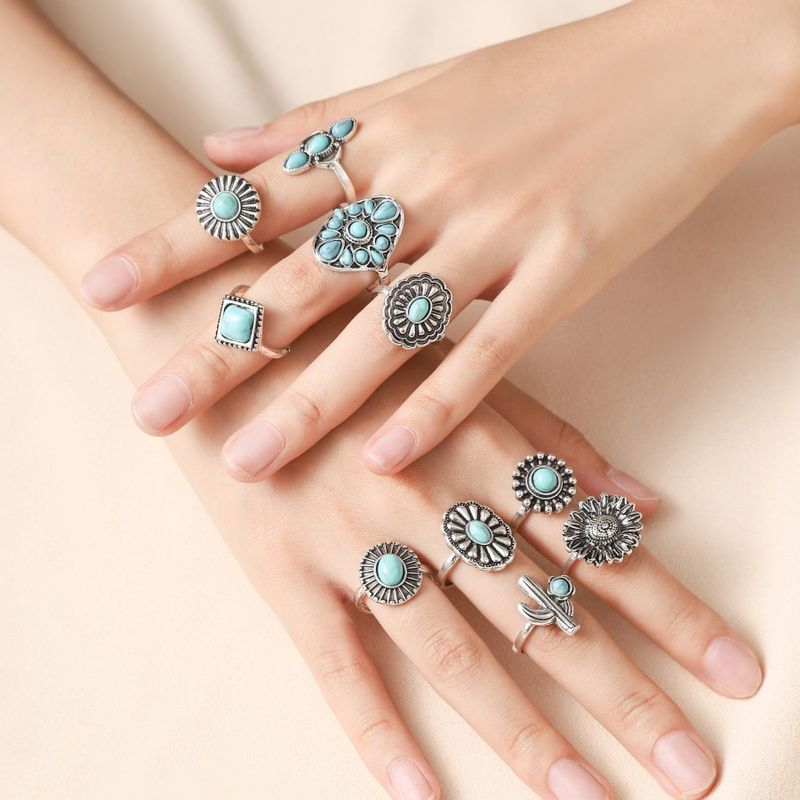 Nuovo set di dieci anelli con goccia d'acqua turchese con fiore geometrico esagerato_voghion.com