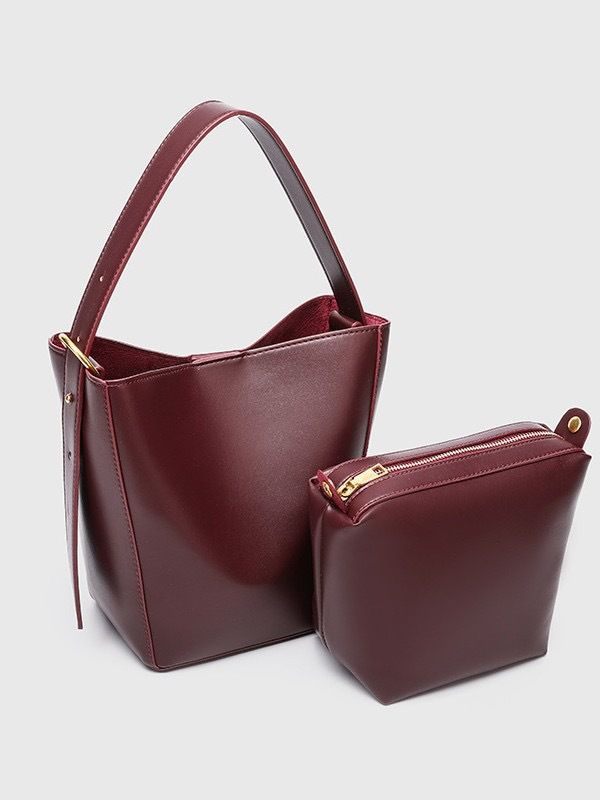 single Shoulder Crossbody Bag That Exudes A Sense Of Luxury And A Niche Design. It Features A Bucket Bag, A Handle, And A Mother Bag_voghion.com