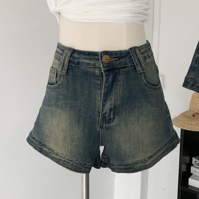Pantaloncini in denim elasticizzati slim fit per capispalla da donna estivi a vita alta Instagram con natiche a trapezio invecchiate americane_voghion.com