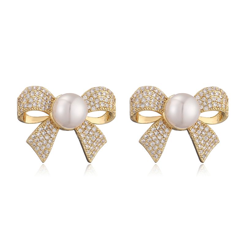 1 paio di orecchini a bottone in rame con intarsi a fiocco dolce e strass_voghion.com