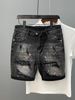 2025 Lente en zomermode voor heren, gewassen, gescheurd, gepatcht, met inktspatten, slim fit, kleine voet, grijszwarte denim shorts voor heren_voghion.com