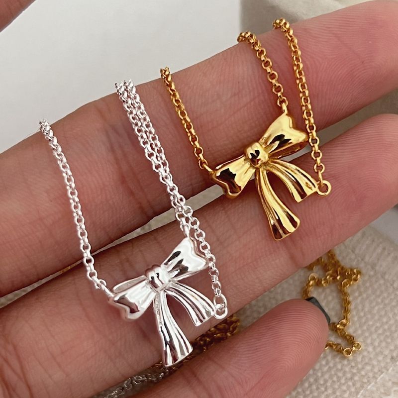 Collana con fiocco in argento sterling, leggera e di lusso, con design di nicchia coreano INS, con nodo a nastro, per donna_voghion.com