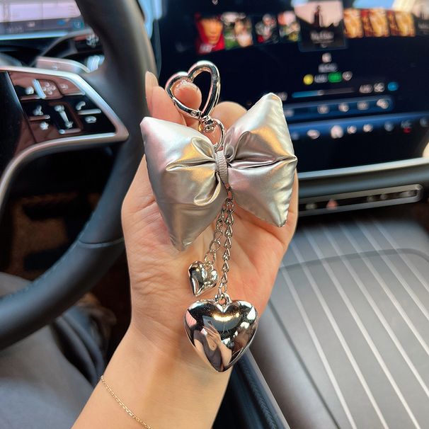 Nuova e creativa moda ciondolo a forma di cuore in argento con fiocco, decorazione versatile per custodia per telefono_voghion.com