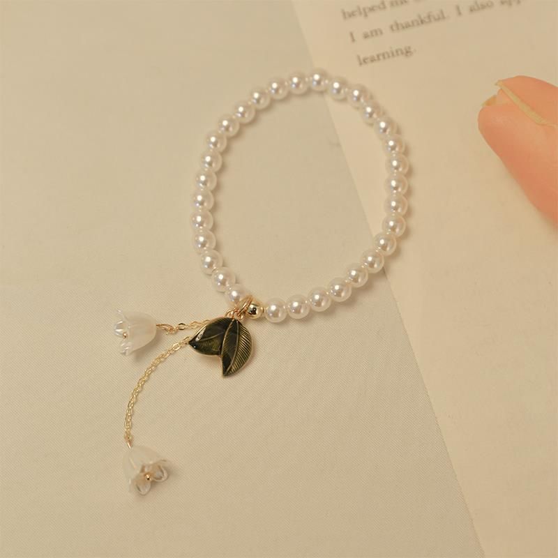 Super onsterfelijk meisje zomer temperament lederen band bel orchidee kwastje parel touw armband haarlus hoogwaardige hoofddeksels_voghion.com