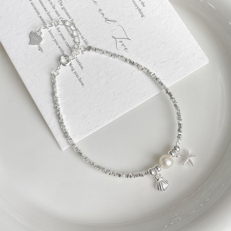 Bracciale con ciondolo in argento puro per donna - Design esclusivo di alta qualità con stelle marine, conchiglie e perle naturali_voghion.com