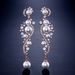 1 par de pendientes largos de perlas y flores de cristal austriaco para mujer, pendientes colgantes de araña para boda, joyería de fiesta, regalo_voghion.com