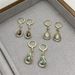 Light High-End Cat's Eye Stone Geometric 2024 New Elegant Face-Slimming Water Drop Earrings_voghion.com