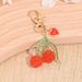 Portachiavi con ciondolo a forma di frutta e ciliegia, zaino, custodia per auricolari e telefono._voghion.com