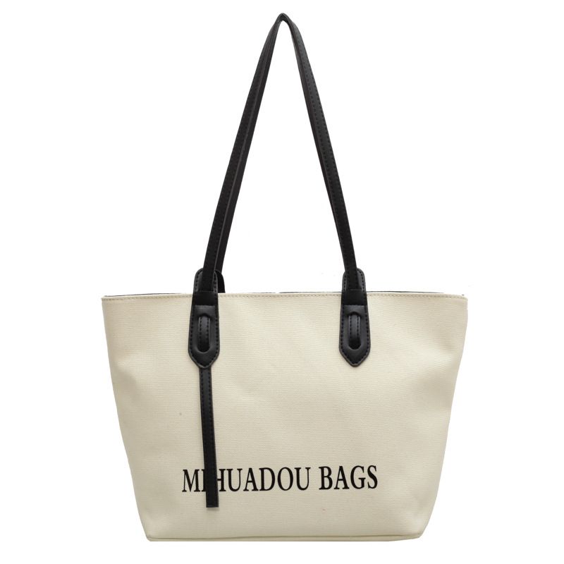 Canvas Large Bag Women 2023 New Fashion Commuter Shoulder Bag Solid Color letter style urban simple tote bag_voghion.com