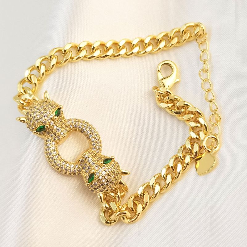 Catena cubana da strada hip-hop, personalità esagerata, in rame placcato oro, micro-intarsiato, zircone bianco e nero a doppia testa_voghion.com
