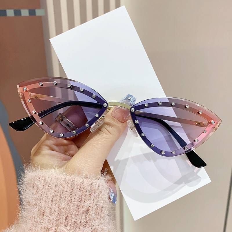 New European And American Colorful Rimless Diamond-encrusted Cat's Eye Sunglasses Street Shooting Catwalk Personalized Decorative Sunglasses_voghion.com