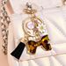 Porte-clés avec pompon et nœud papillon imprimé léopard, nouvelle mode, mignon, pendentif pour sac_voghion.com