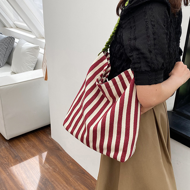 Lazy style canvas women's large capacity 2024 new spring striped contrasting artistic shoulder bag handbag_voghion.com