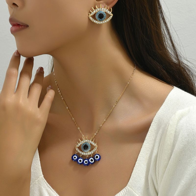 Instagram veelzijdige hiphop-stijl dames oorbellen ketting set met gepersonaliseerde duivelsoog diamanten design oorbellen en_voghion.com