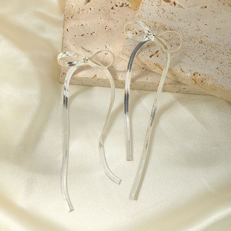 Verkupferte, vergoldete Schleife mit langer Quaste, einfache, klassische, geknotete französische Ohrringe aus Metallband, Nadel aus 925er Silber_voghion.com