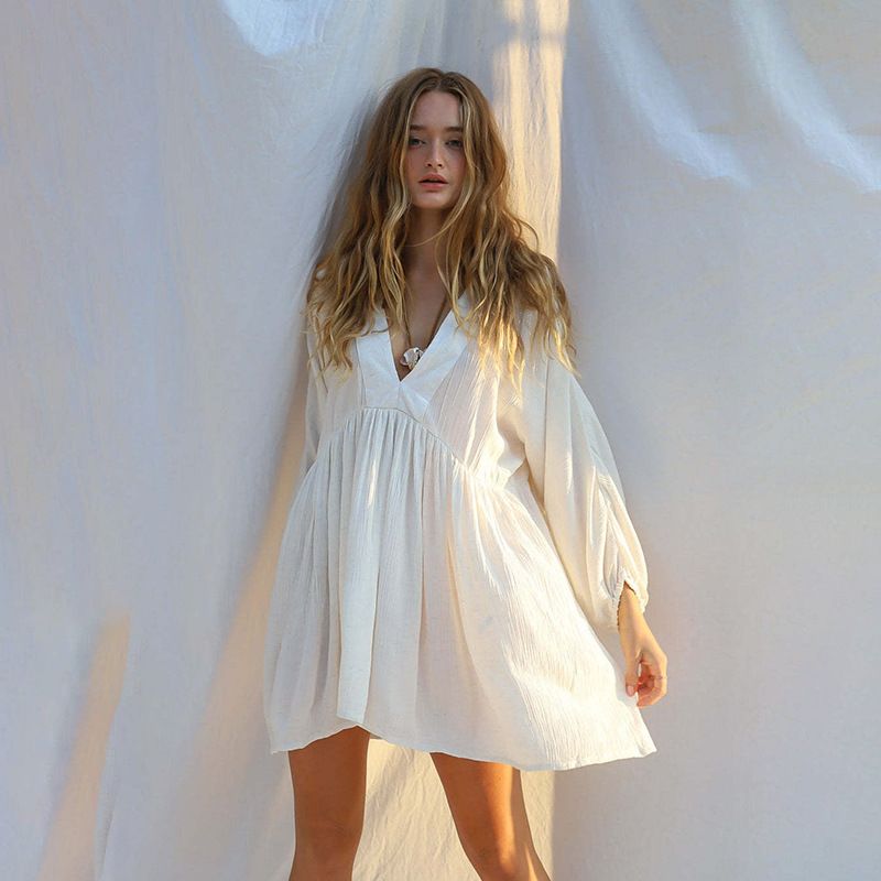 Women's beach wrinkle-proof fabric long sleeves and deep V-skirt holiday bikini_voghion.com