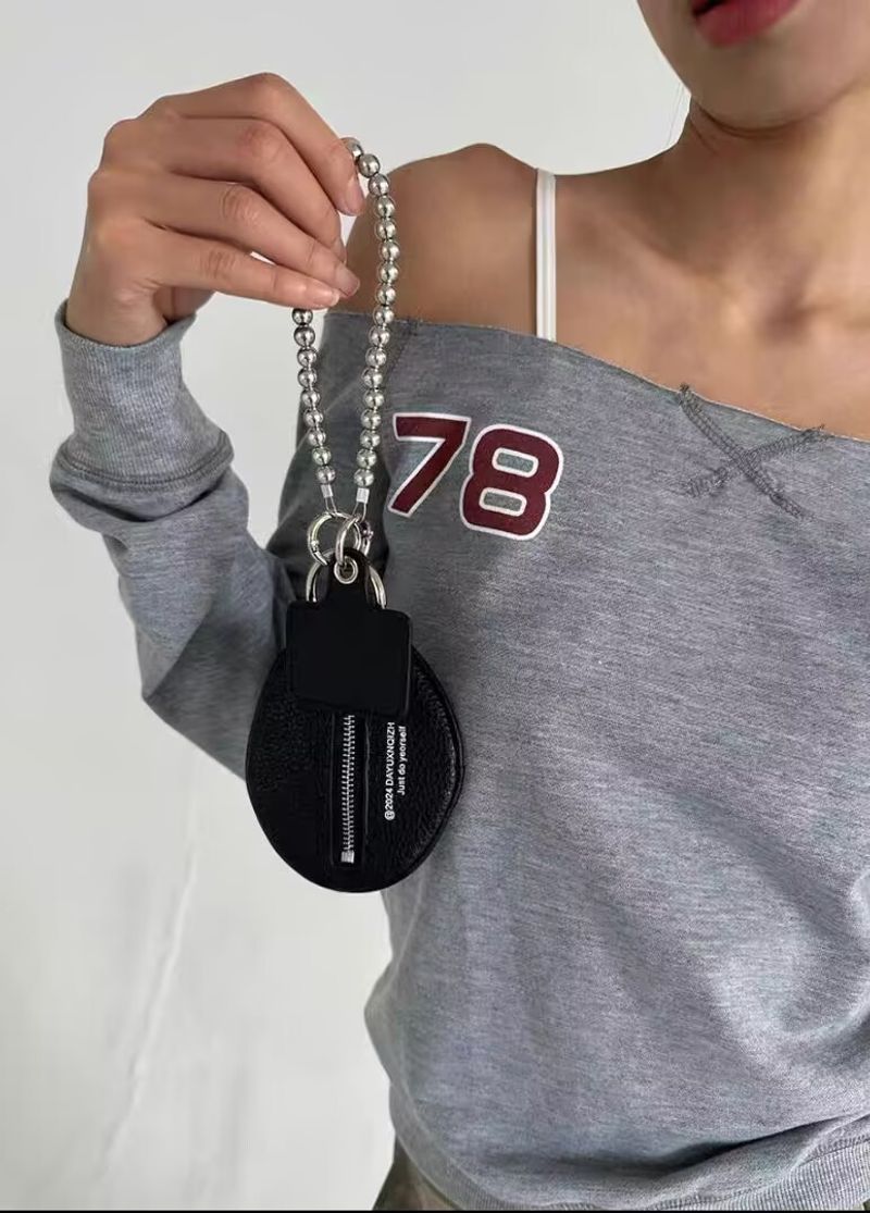 2025 Nouveau sac à clés texturé à motif litchi à la mode Petit pendentif Un accessoire Pendentif Sac Petit_voghion.com