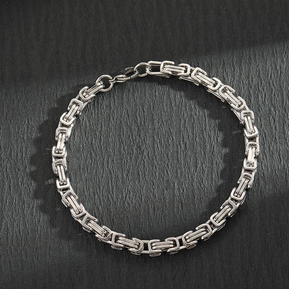 Bracciale da uomo alla moda in acciaio inossidabile nero con fibbia quadrata in titanio e catena intrecciata Hip Hop con chiusura a moschettone_voghion.com