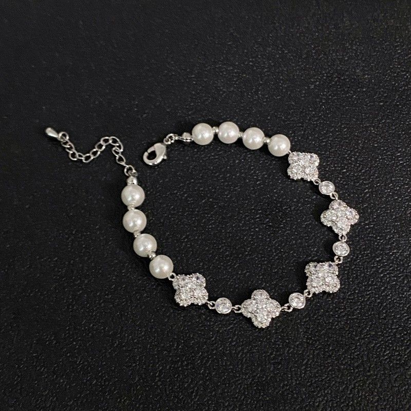 Designer micro-inset Zircon four-leaf clover flower pearl silver bracelet delicate temperament niche design hand jewelry_voghion.com