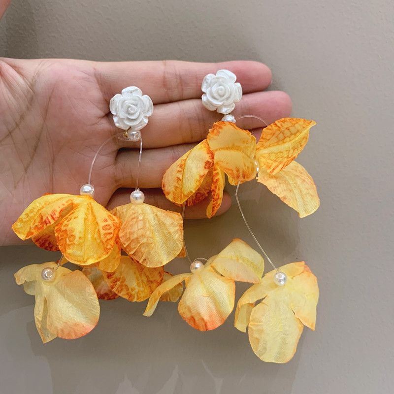 Orecchini unisex con nappa a forma di fiore ardente, orecchini a petalo con simulazione di viaggio retrò super fata, orecchini esagerati unici_voghion.com