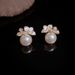 S Silver Needle Light Luxury Elegant White Lacquer Flower Pearl For Women Niche Fashion Design Versatile Earrings_voghion.com