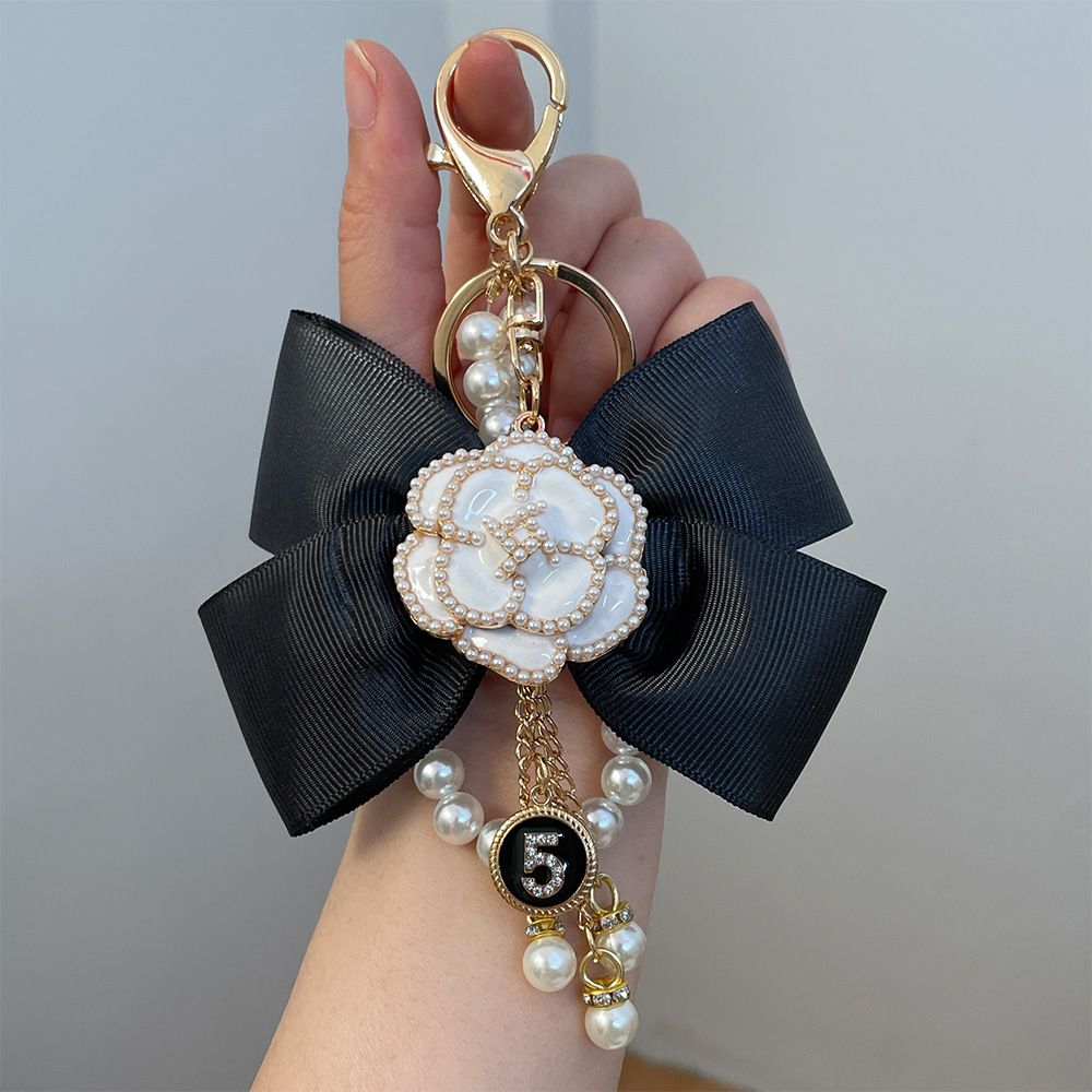 High grade exquisite camellia flower scented water bottle with diamond pearl string bag key chain pendant small gift_voghion.com