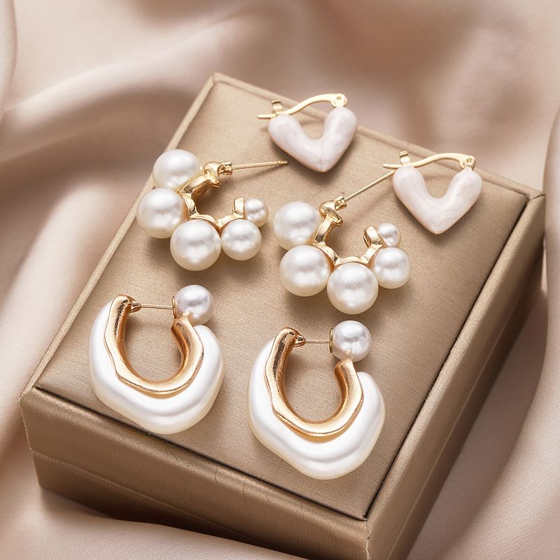 1 set di orecchini a bottone in resina con perle in stile semplice e casual con intarsi geometrici_voghion.com