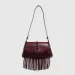 2025 New Rivet Hollow Single Shoulder Handbag Magnetic Buckle Tassel Saddle Zipper Pleated Women's Bag_voghion.com