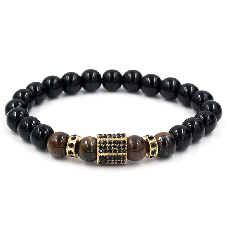 Bracciale da uomo con distanziatore in pietra di occhio di tigre nera e micro intarsi di diamanti_voghion.com