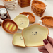Piatto piccolo in ceramica con testa di pane, simpatico cartone animato, con sapore creativo, per spuntini casalinghi, con salsa di condimento colorata sotto smalto._voghion.com