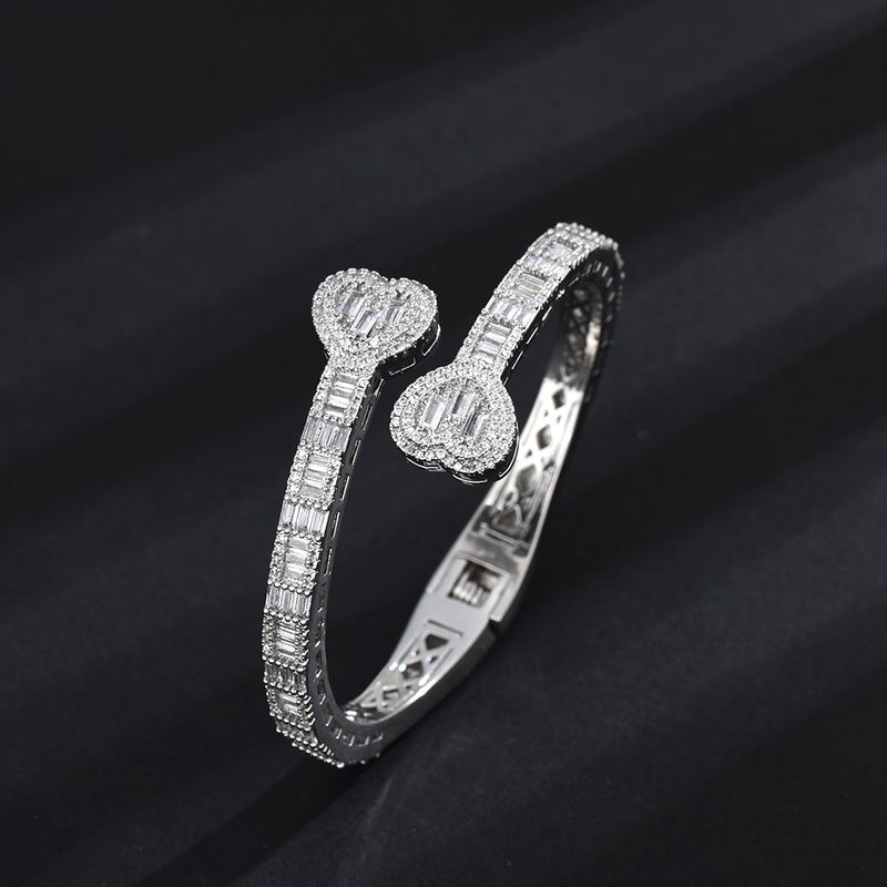 Pulsera de moda con incrustaciones de diamantes y geometría personalizada con hebilla de primavera de estilo hip hop, pieza de mano de circón_voghion.com