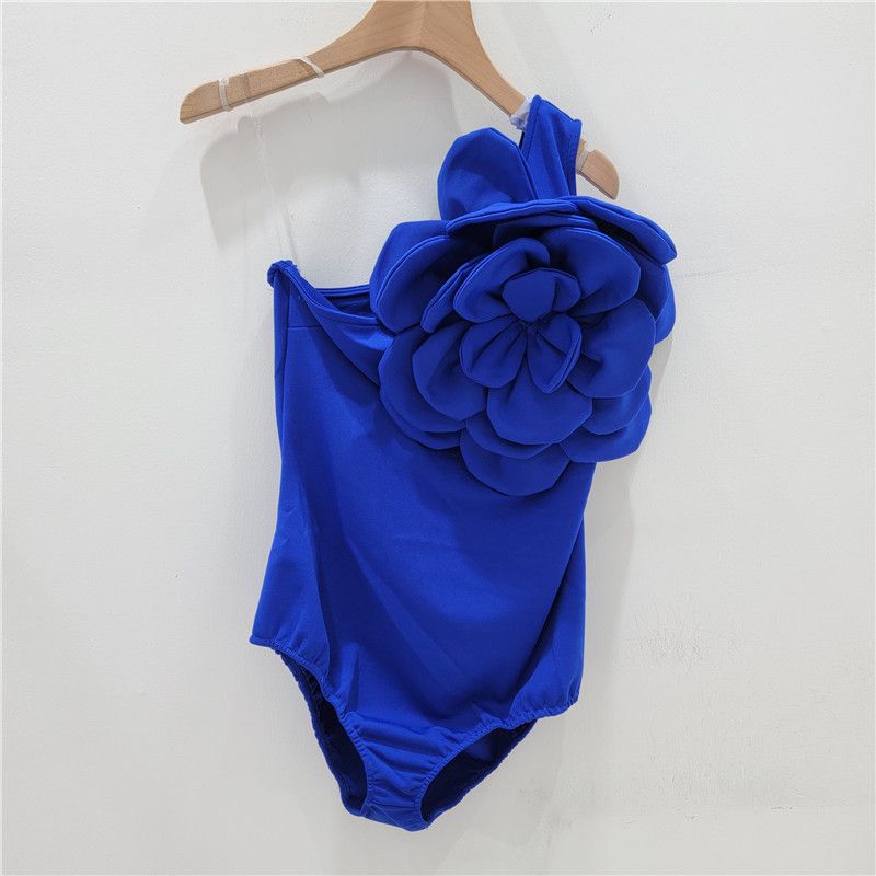 Women's fashion exaggerated three-dimensional flower decoration asymmetrical sexy backless suspender jumpsuit T-shirt_voghion.com