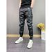 Pantaloni casual alla moda in pelle PU elastica da uomo, antivento e impermeabili, a sei tasche, tinta unita_voghion.com
