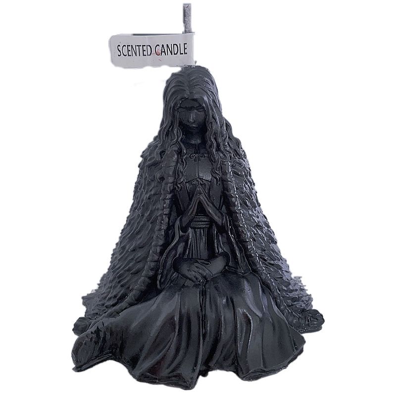 Vela con aroma a bruja de Halloween: figura de mujer sentada con una misteriosa maga_voghion.com