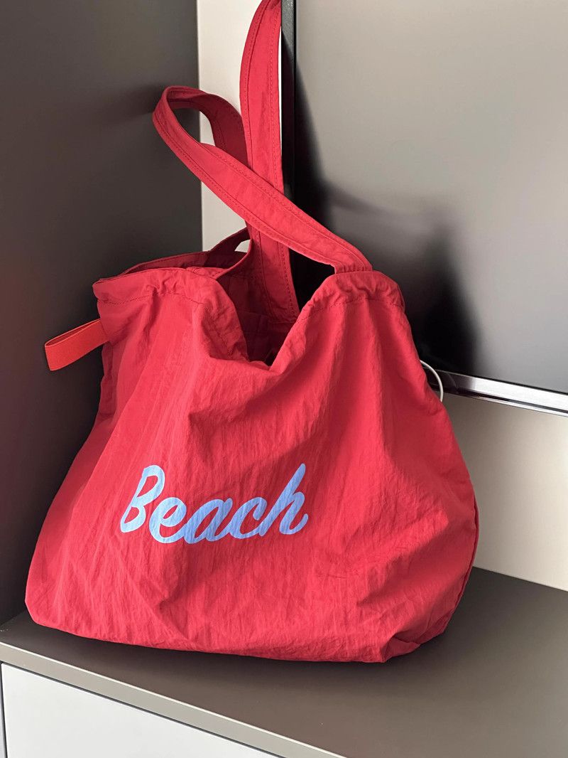 Borsa a tracolla grande capacità in tela con coulisse autunno 2024 da donna_voghion.com