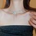 Collana girocollo con nappa di perle e farfalla in argento da donna, nuova e popolare collana di alta qualità del 2024_voghion.com