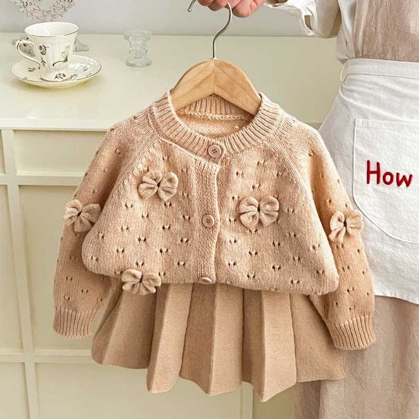 2025 New Girls Knitted Sweater Two Piece Korean Round Neck Solid Color Bowknot Hollow Single Breasted Suit Skirt_voghion.com