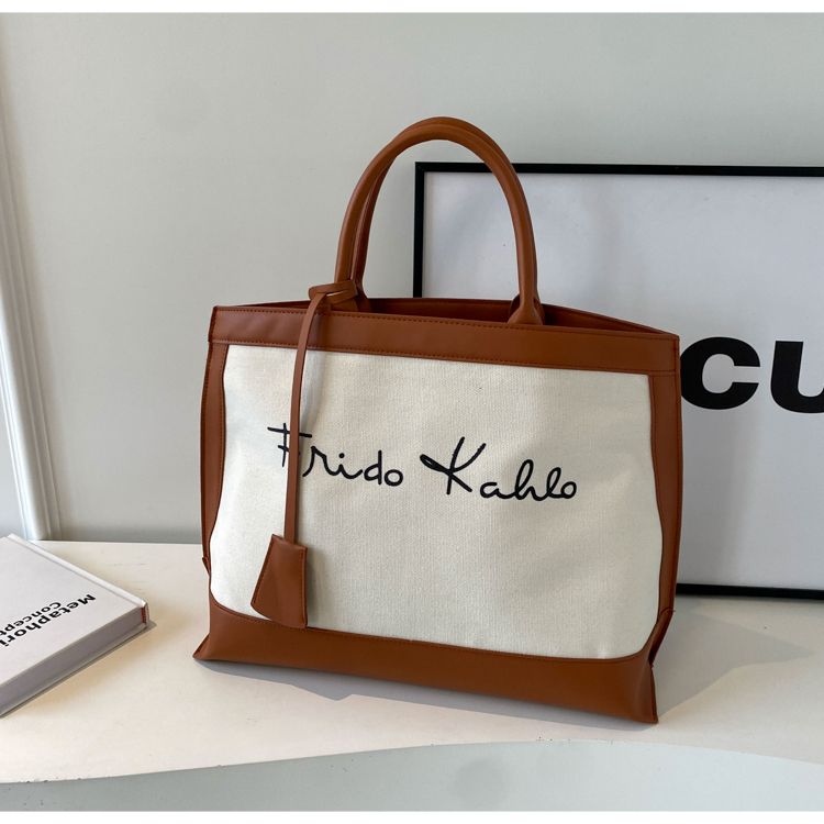 Eine Nischen-Designer-Canvas-Tasche für Damen 2024, eine neue, großvolumige Umhängetasche für den Arbeitsweg_voghion.com