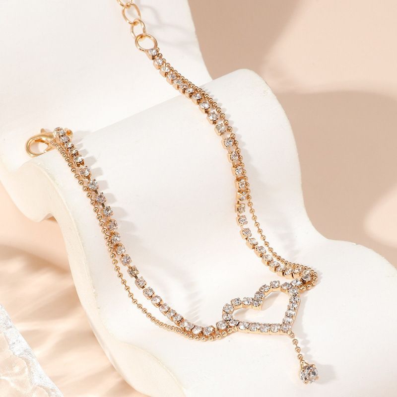 Cavigliera con perline a forma di goccia d'acqua a forma di cuore lucido, stile unico e di lusso, con strass, moda, multistrato, per donna_voghion.com