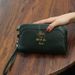 2025 Exquisite Bee Hardware Koeienhuid Casual Grote Capaciteit Handheld Portemonnee Dames Clutch Bag_voghion.com