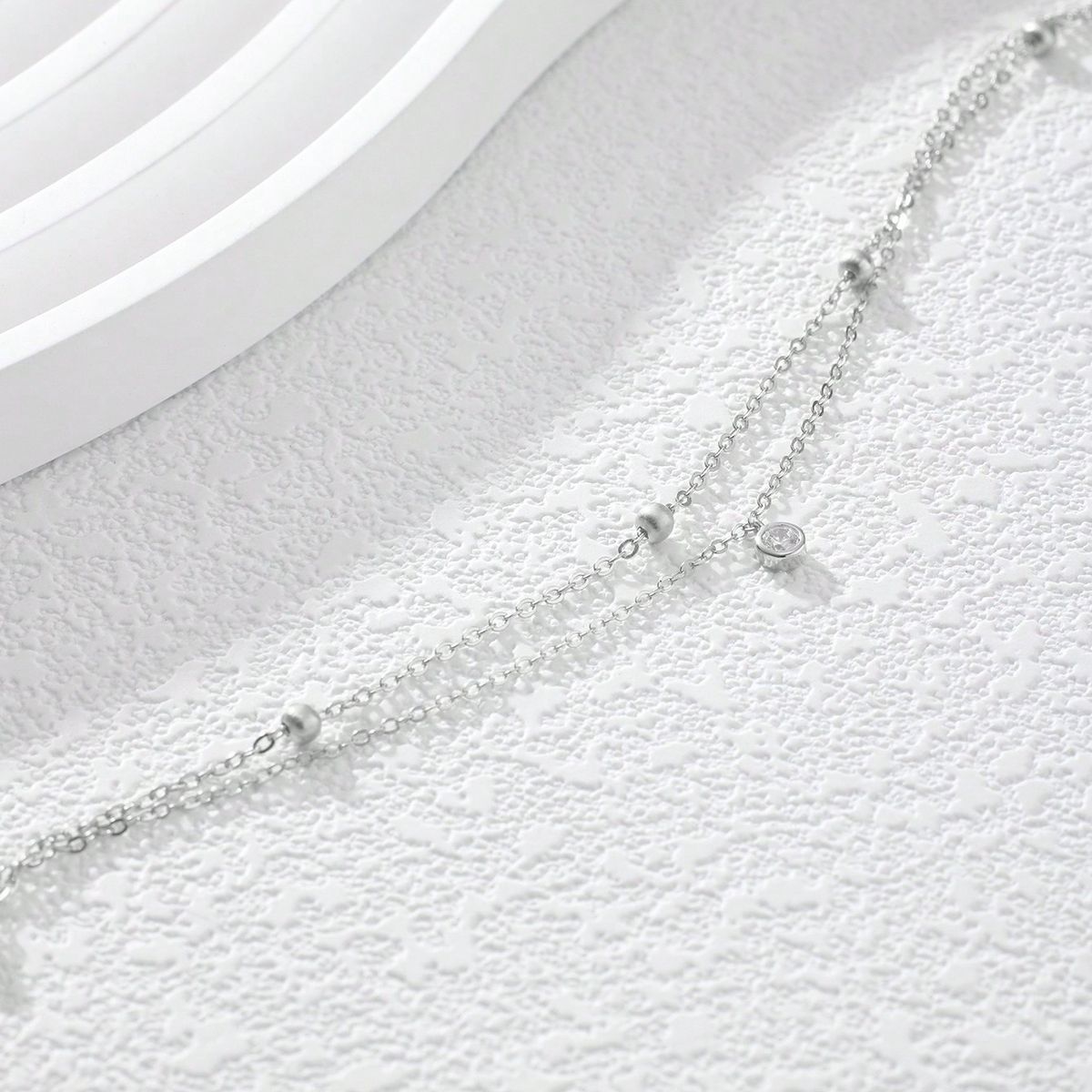Un gioiello da caviglia per le donne, con ciondolo in zircone artificiale rotondo, minimalista, elegante, leggero e lussuoso, a doppio strato, in argento._voghion.com