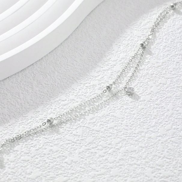 Un gioiello da caviglia per le donne, con ciondolo in zircone artificiale rotondo, minimalista, elegante, leggero e lussuoso, a doppio strato, in argento._voghion.com