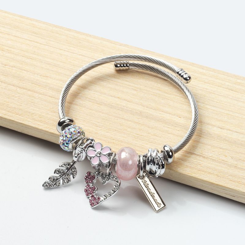 Bracciale alla moda in acciaio inossidabile e titanio con cuore aperto fai da te in stile coreano, con perle e quadrifoglio_voghion.com