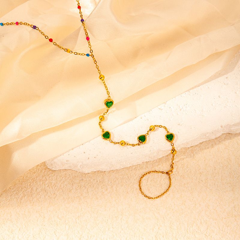 Collana semplice di alta qualità in oro con goccia d'olio multicolore in acciaio al titanio e cuore di smeraldo per donna_voghion.com