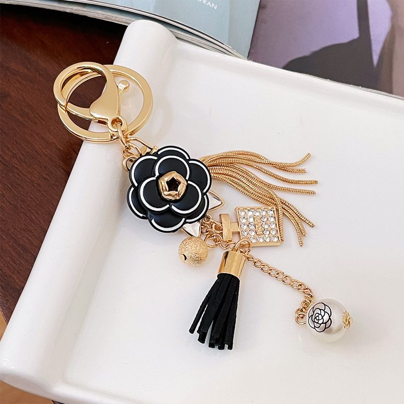 Porte-clés coréen Xiaoxiangfengshan en métal avec pompon camélia, pendentif pour sac de voiture, cadeau exquis_voghion.com