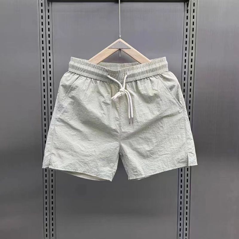Îmbrăcăminte pentru bărbați Pantaloni scurți Moda Casual Versatili Pantaloni de plajă Cu uscare rapidă Culoare uni Tendință simplă Pantaloni în patru puncte în stil sport pentru cuplu_voghion.com