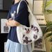 2024 New Spring Outing Dog Shoulder Versatile Large Capacity Canvas Student Commuter Tote Women's Outgoing Bag_voghion.com