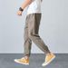 Casual Lightweight Spring Men Joggers Pants Solid Color Drawstring Summer Loose Mid Rise Pockets Trousers for Daily Wear_voghion.com