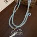 Collana con nappa in vetro blu Gu Feng Chan Yi Qing, nuova ed elegante collana in stile cinese con risvolto a pressione e catena laterale, gonna a forma di volto di cavallo_voghion.com